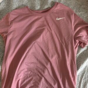 Nike Women's Light Pink Short Sleeve Athletic Tee with White Swoosh